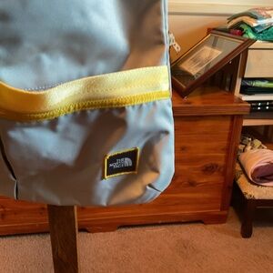 The North Face Gray and Yellow Crossbody Bag.